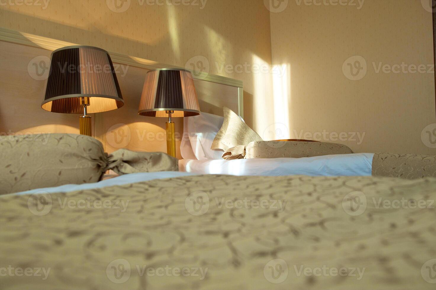 Hotel bed room interior. Sunset light. photo