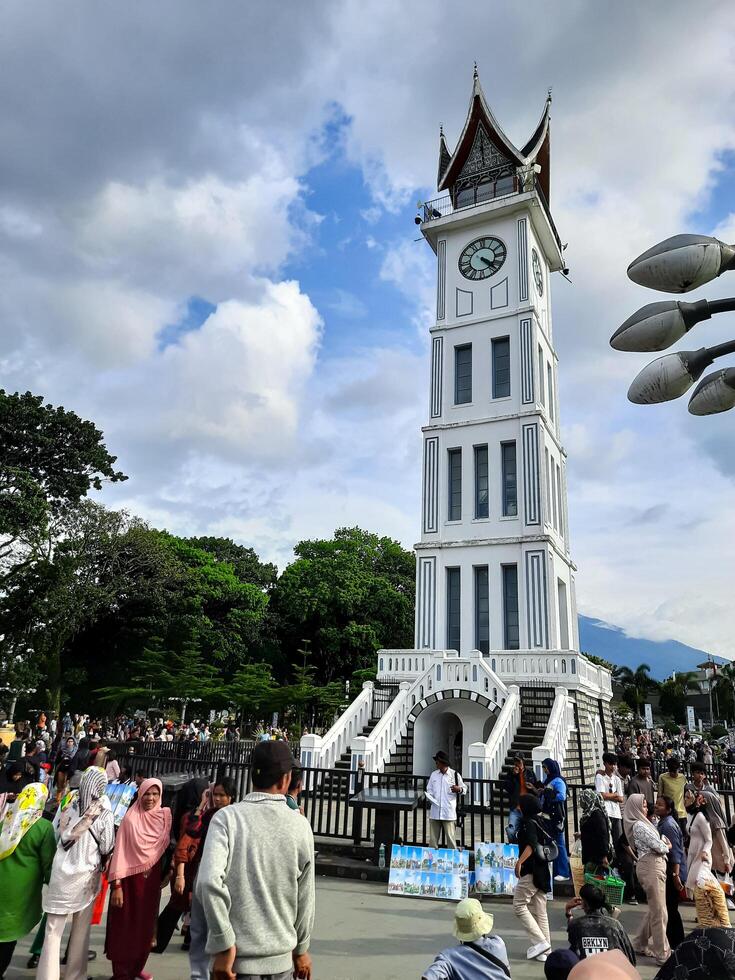 Bukittinggi, Indonesia - April 28, 2024. Bukittinggi Clock Tower or Jam Gadang, one of the world's historical heritages and a tourist destination in Bukittinggi City photo
