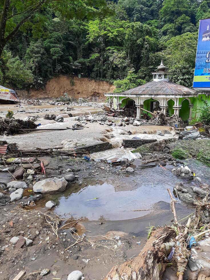 Tanah Datar, Indonesia - May 12, 2024. condition of the mosque affected by cold lava flash floods. Natural Disaster in Lembah Anai, Sepuluh Koto District, Tanah Datar, West Sumatra, Indonesia photo