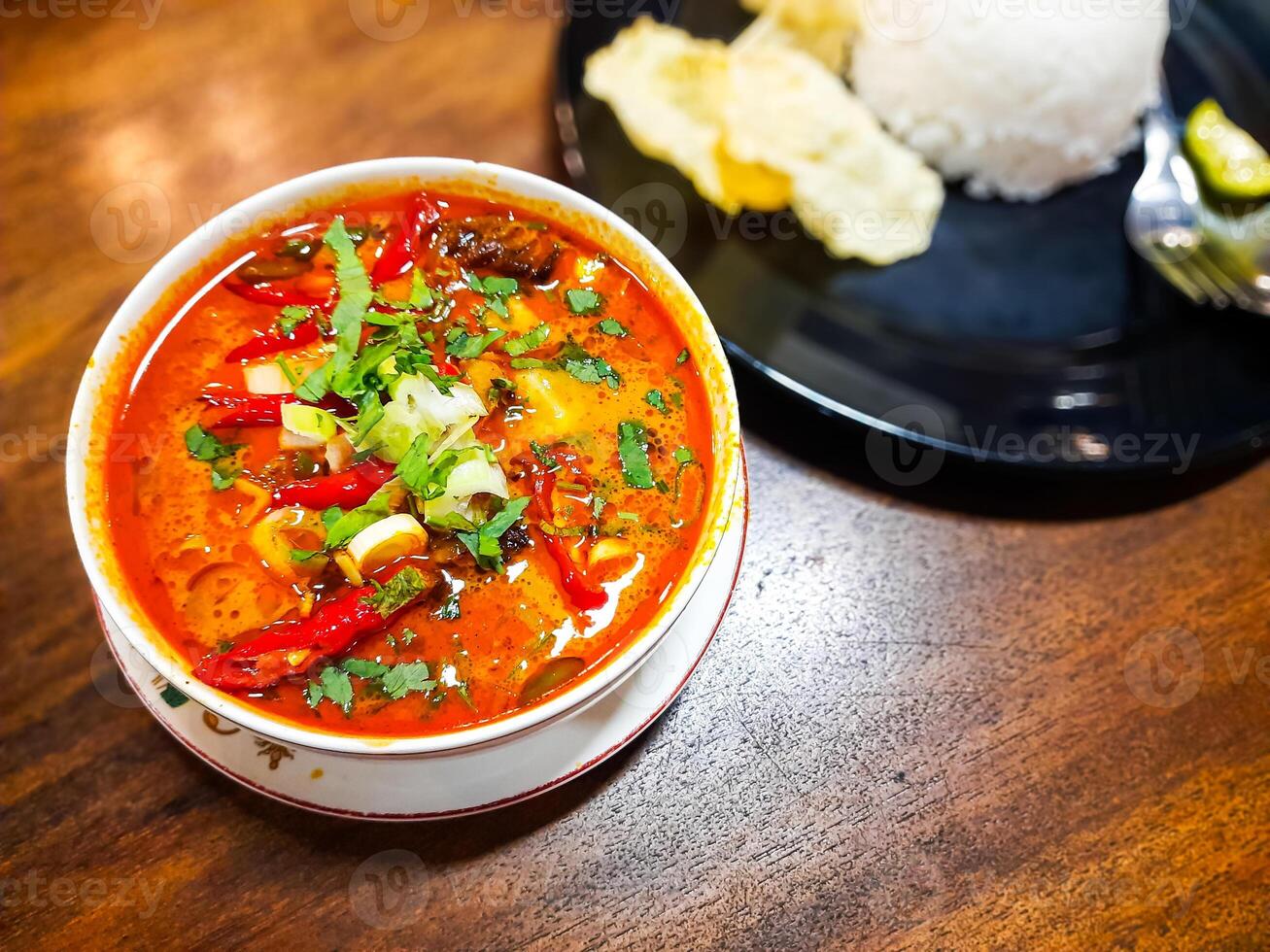 Beef Tongseng food, an Indonesian dish made from boiled beef in a curry-like sauce or soup with vegetables photo