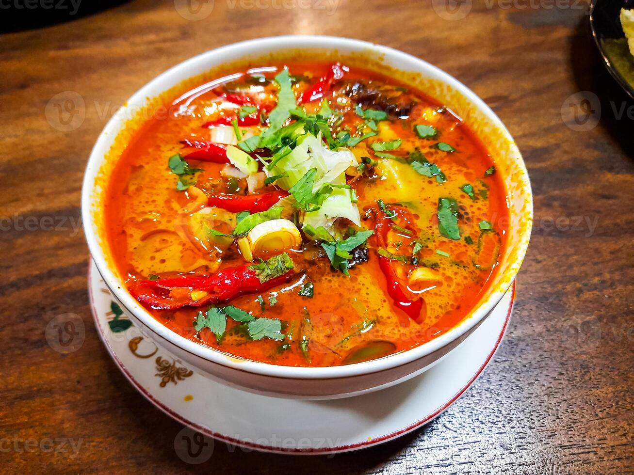 Beef Tongseng food, an Indonesian dish made from boiled beef in a curry-like sauce or soup with vegetables photo