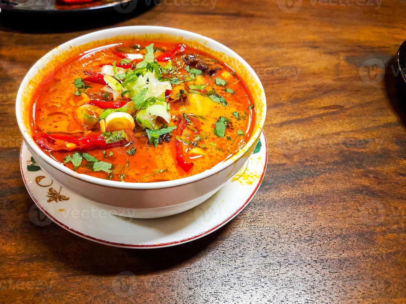 Beef Tongseng food, an Indonesian dish made from boiled beef in a curry-like sauce or soup with vegetables photo