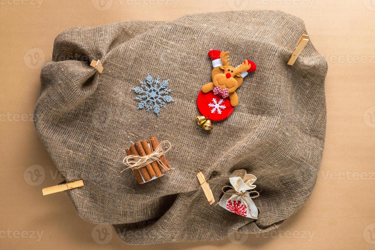 Christmas decoration on natural sackcloth background photo