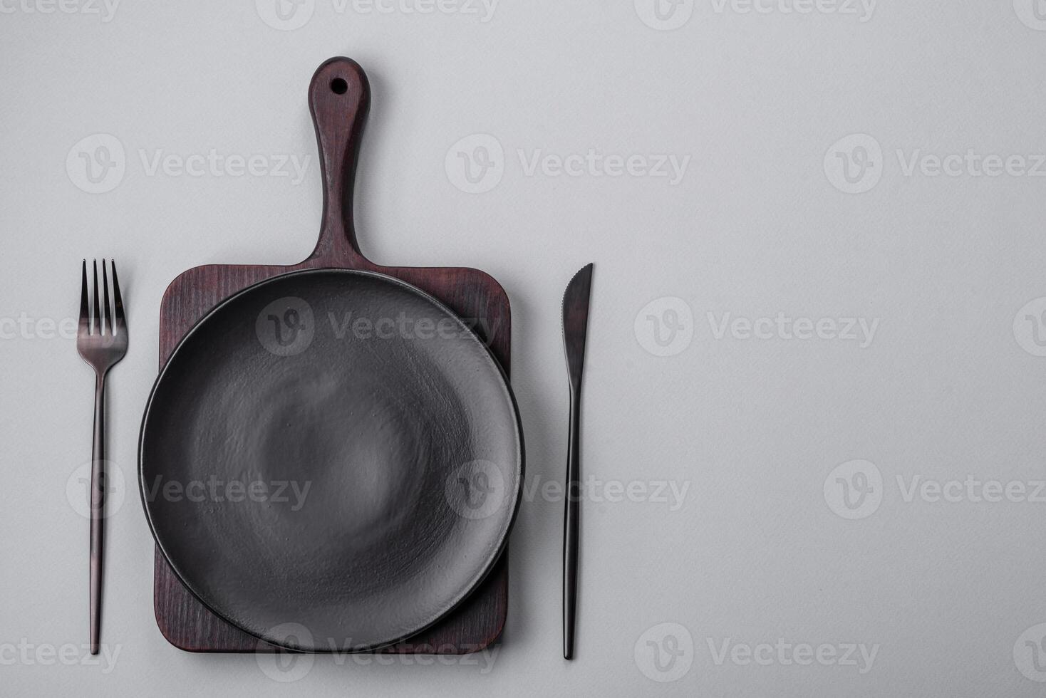 An empty plate on a gray concrete background with copy space photo