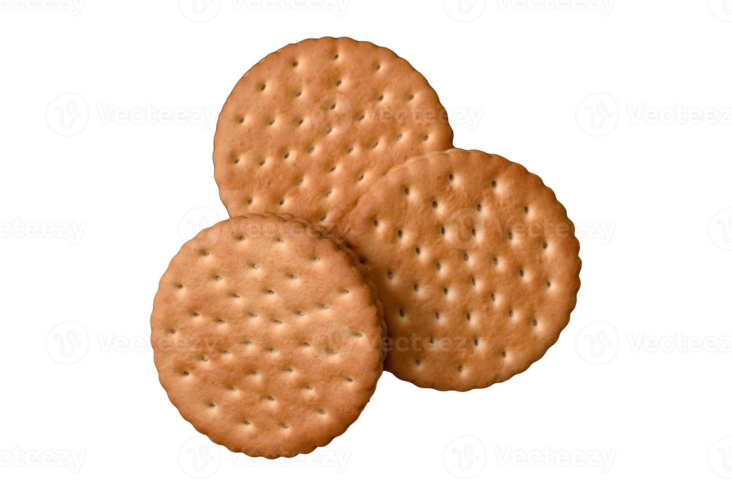 Round dotted snack snack cookies with cream on a dark concrete background photo