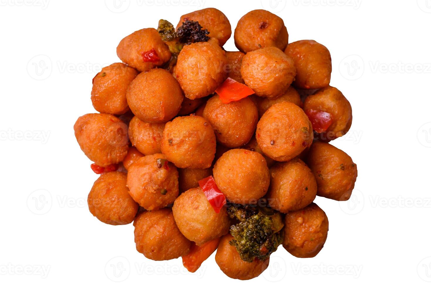 Delicious fried potato balls with vegetables, salt, spices and herbs photo