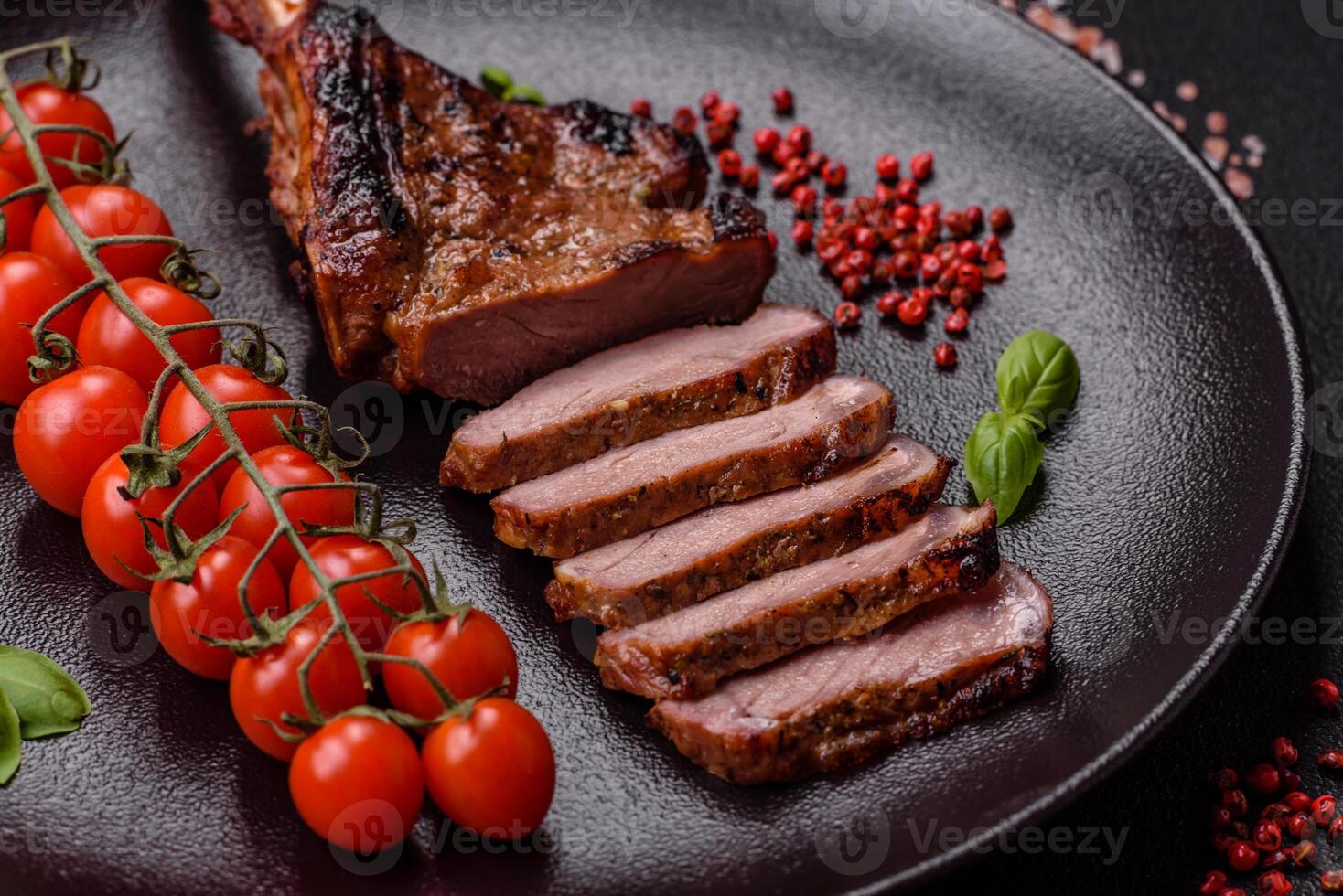 Delicious juicy beef steak on the bone, tomahawk with salt, spices and herbs photo