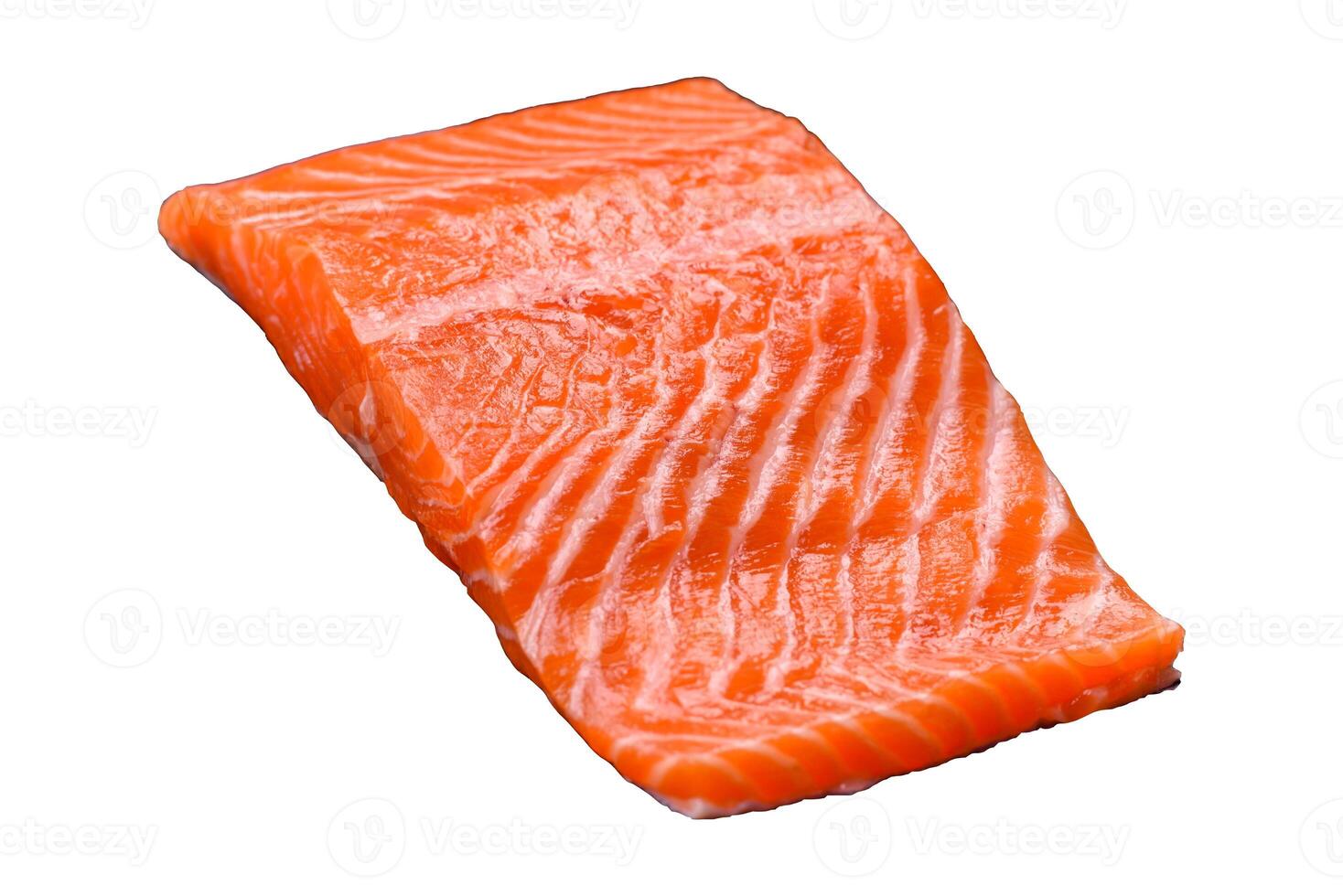 Fresh raw salmon steak with spices and herbs prepared for grilled baking photo