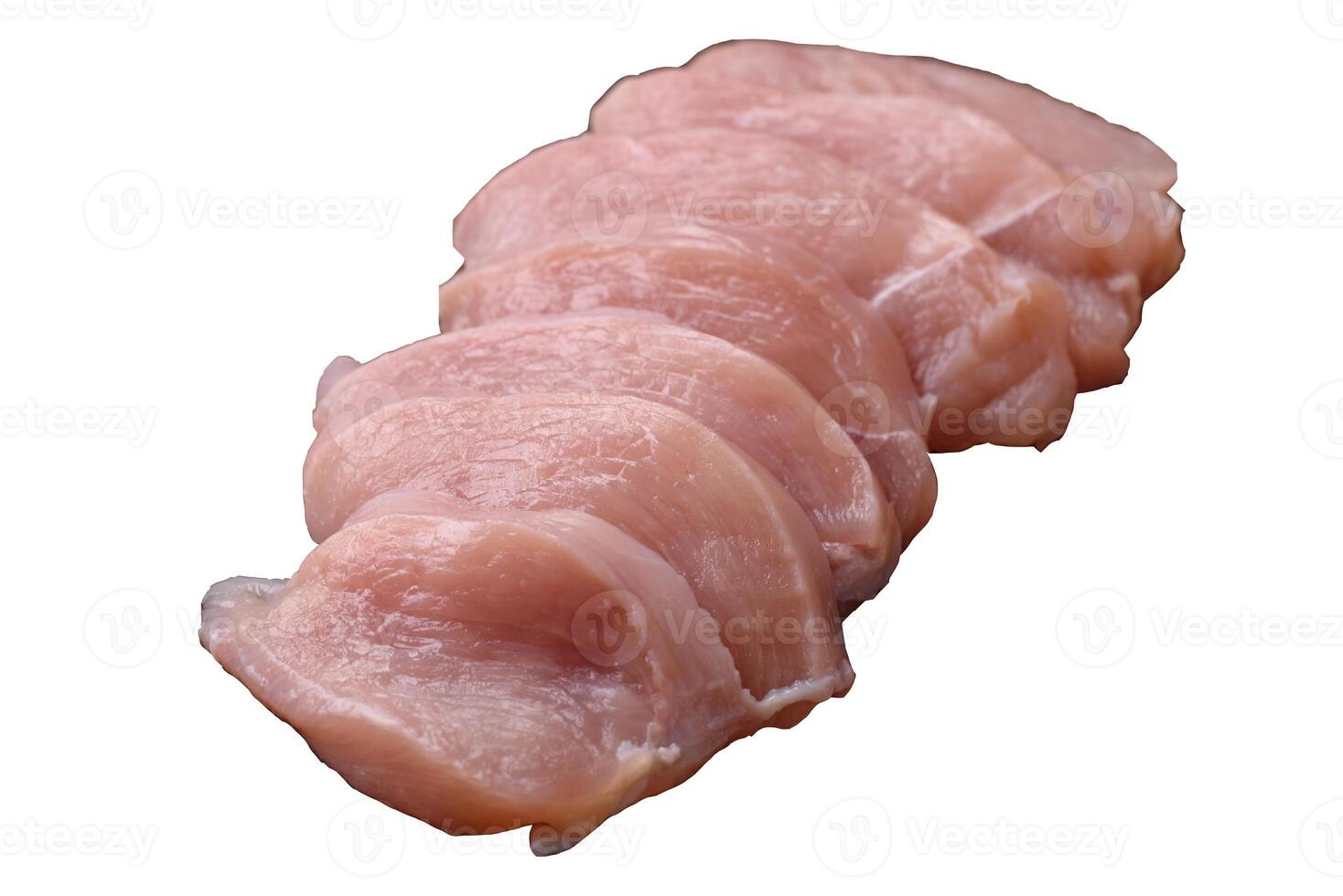 Slices of raw chicken or turkey fillet with salt, spices and herbs photo