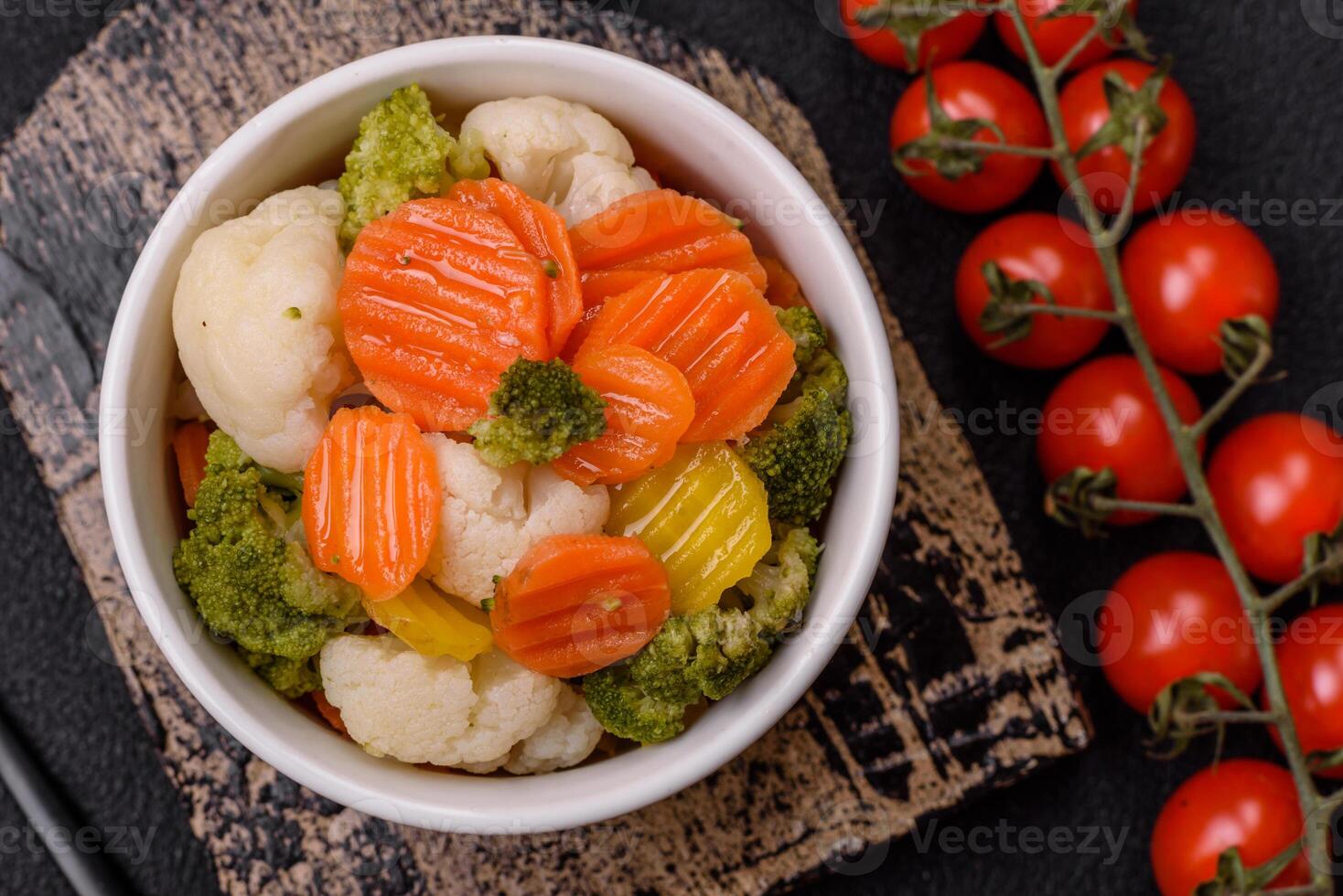 Delicious fresh vegetables broccoli, cauliflower, carrots steamed with salt photo
