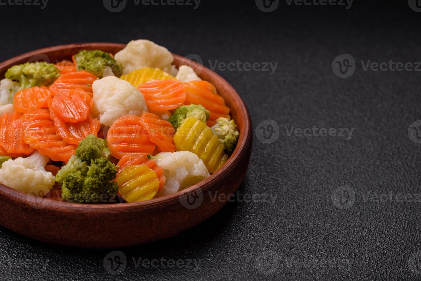 Delicious fresh vegetables broccoli, cauliflower, carrots steamed with salt photo
