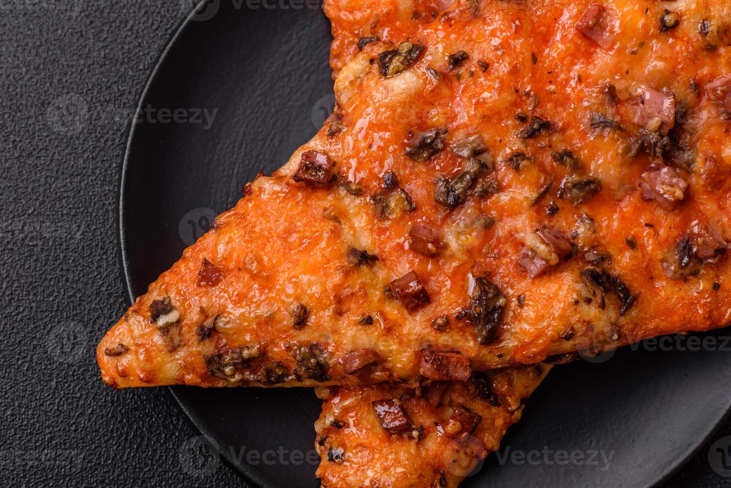 Slices of delicious street pizza with sausage, mushrooms, tomatoes and cheese photo