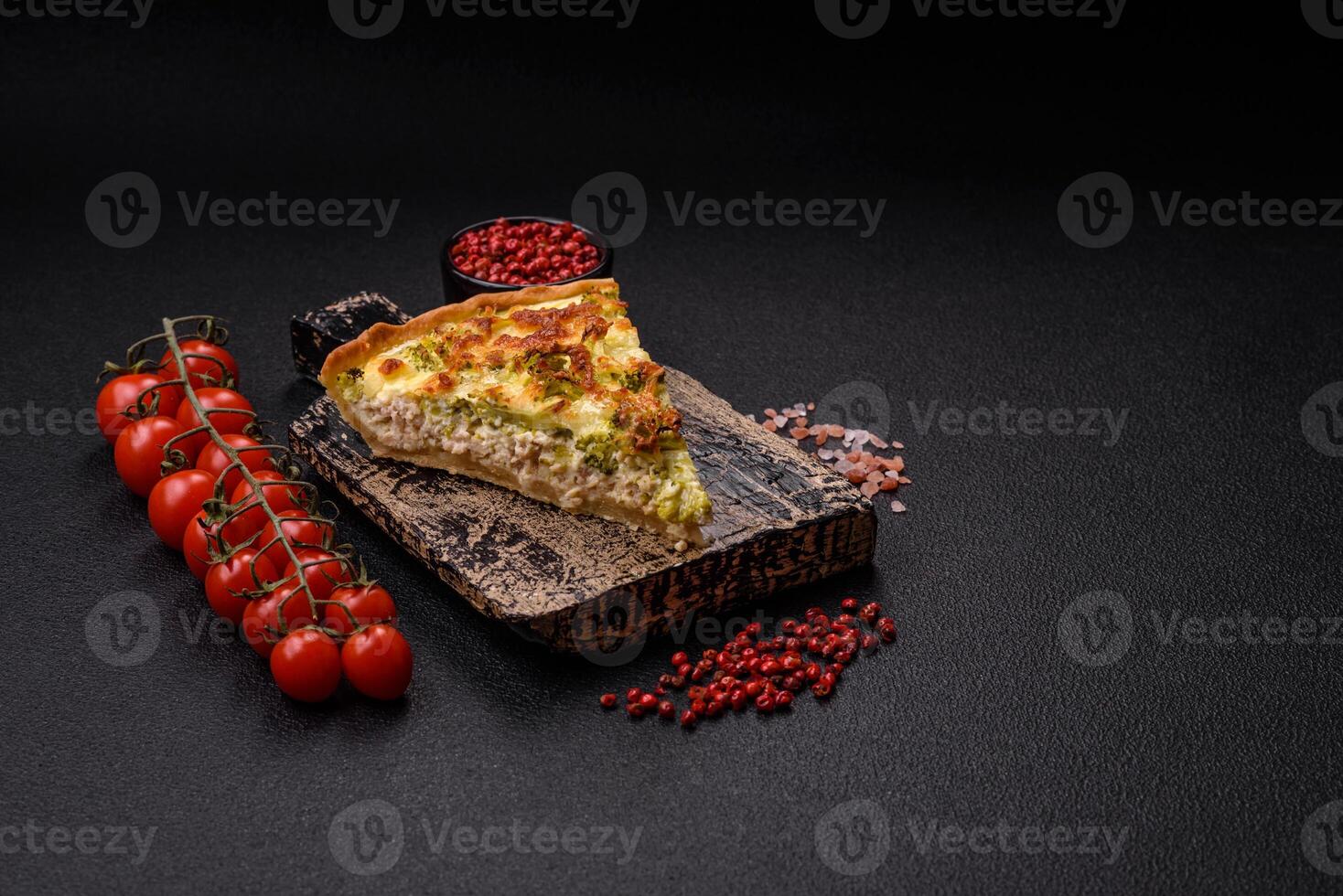 Delicious quiche with broccoli, cheese, chicken, spices and herbs photo