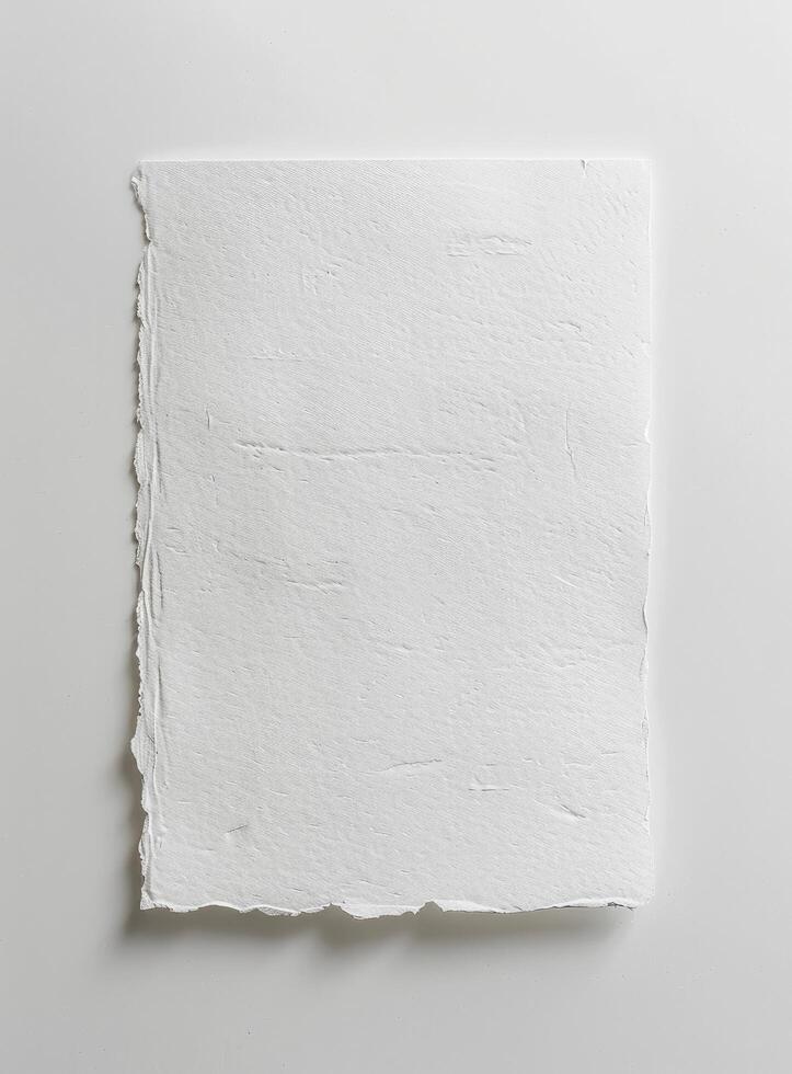 a white piece of paper with the texture of cotton on white background photo