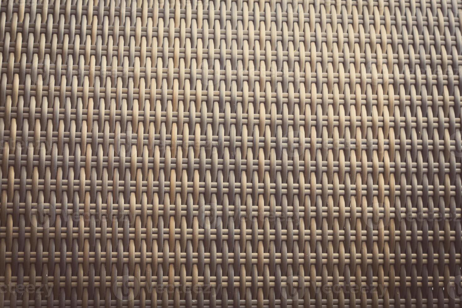 Synthetic rattan texture weaving background as used on outdoor garden furniture. photo
