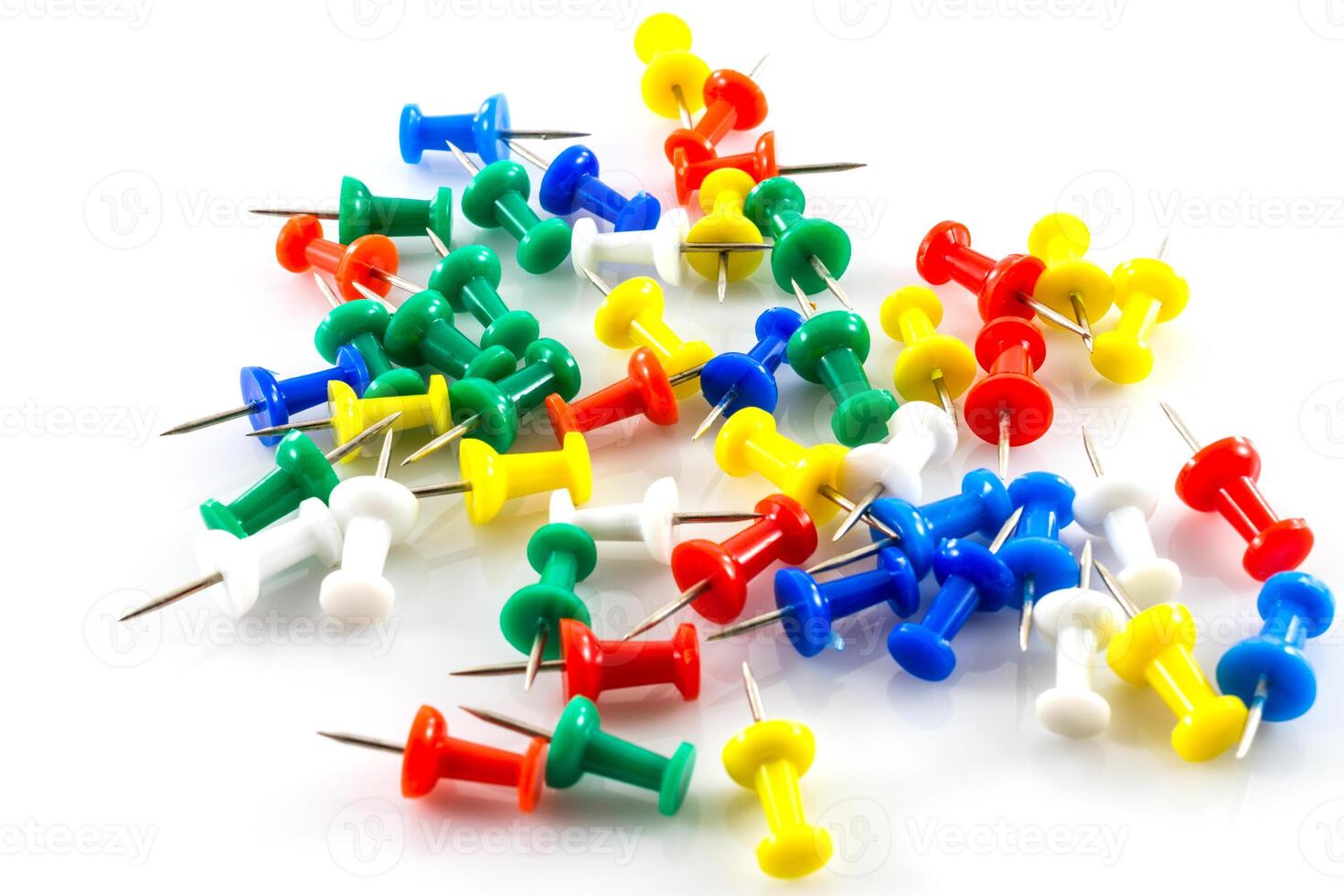 colorful push pins on white photo