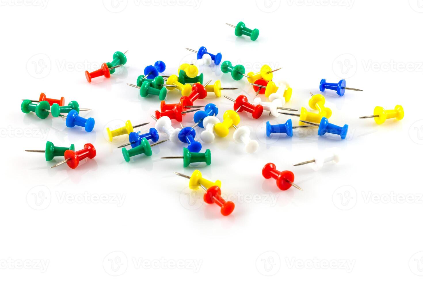 colorful push pins on white photo