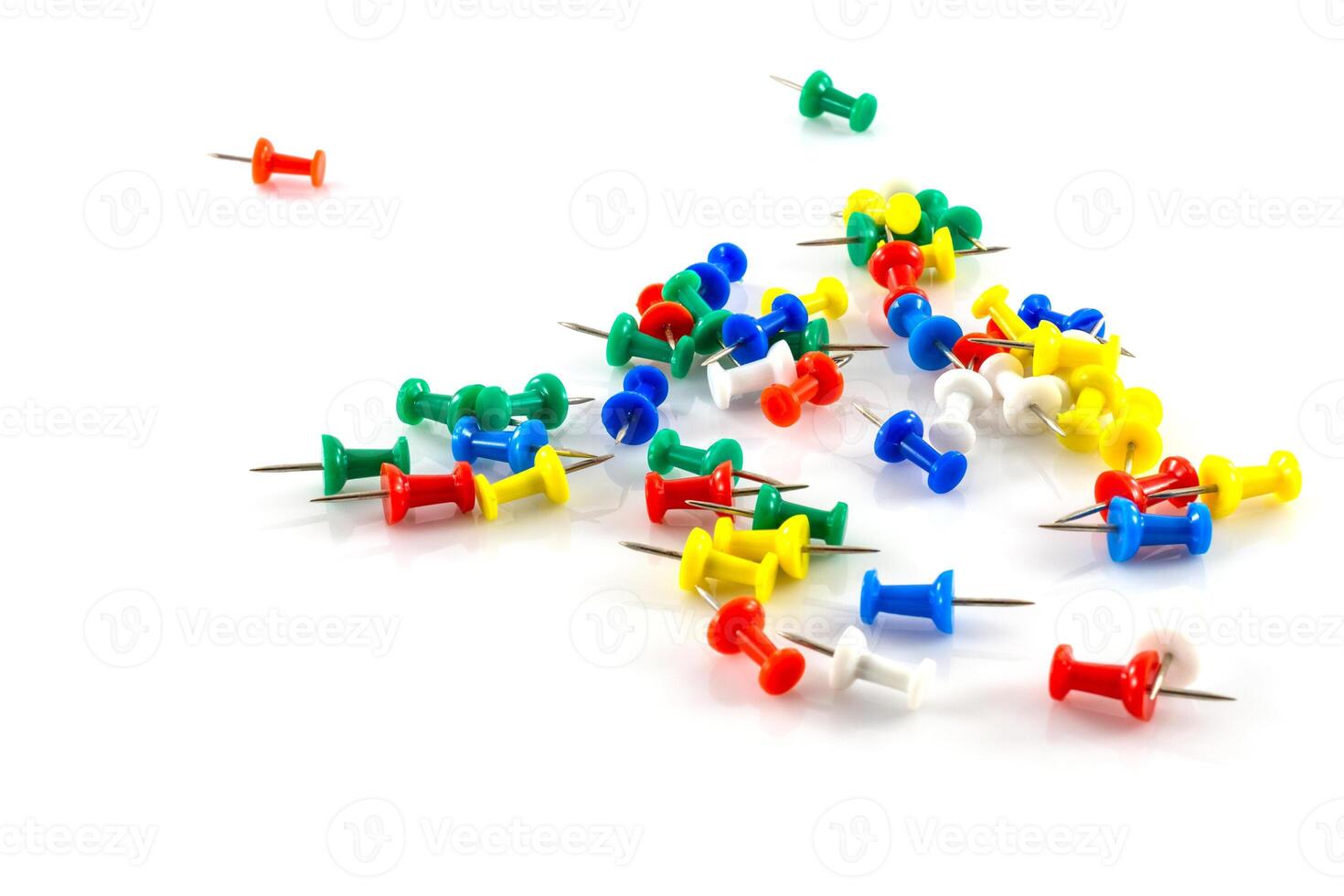 colorful push pins on white photo