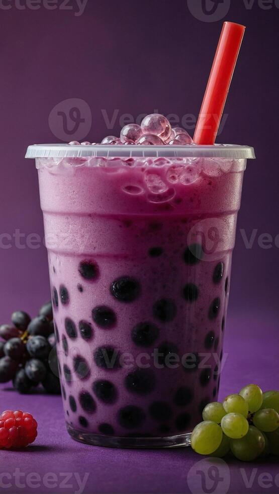 Studio shot of refreshing grape bubble tea with tapioca pearls on the purple background photo