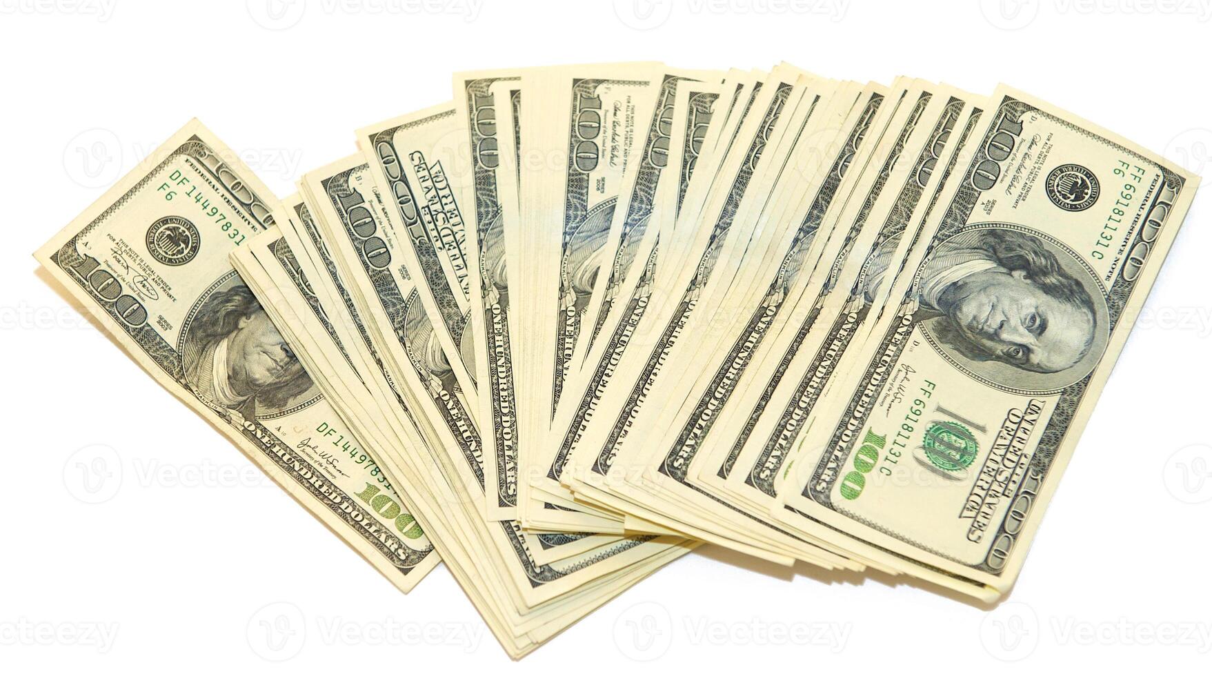 American dollars arranged in stacks of 100 bills each photo