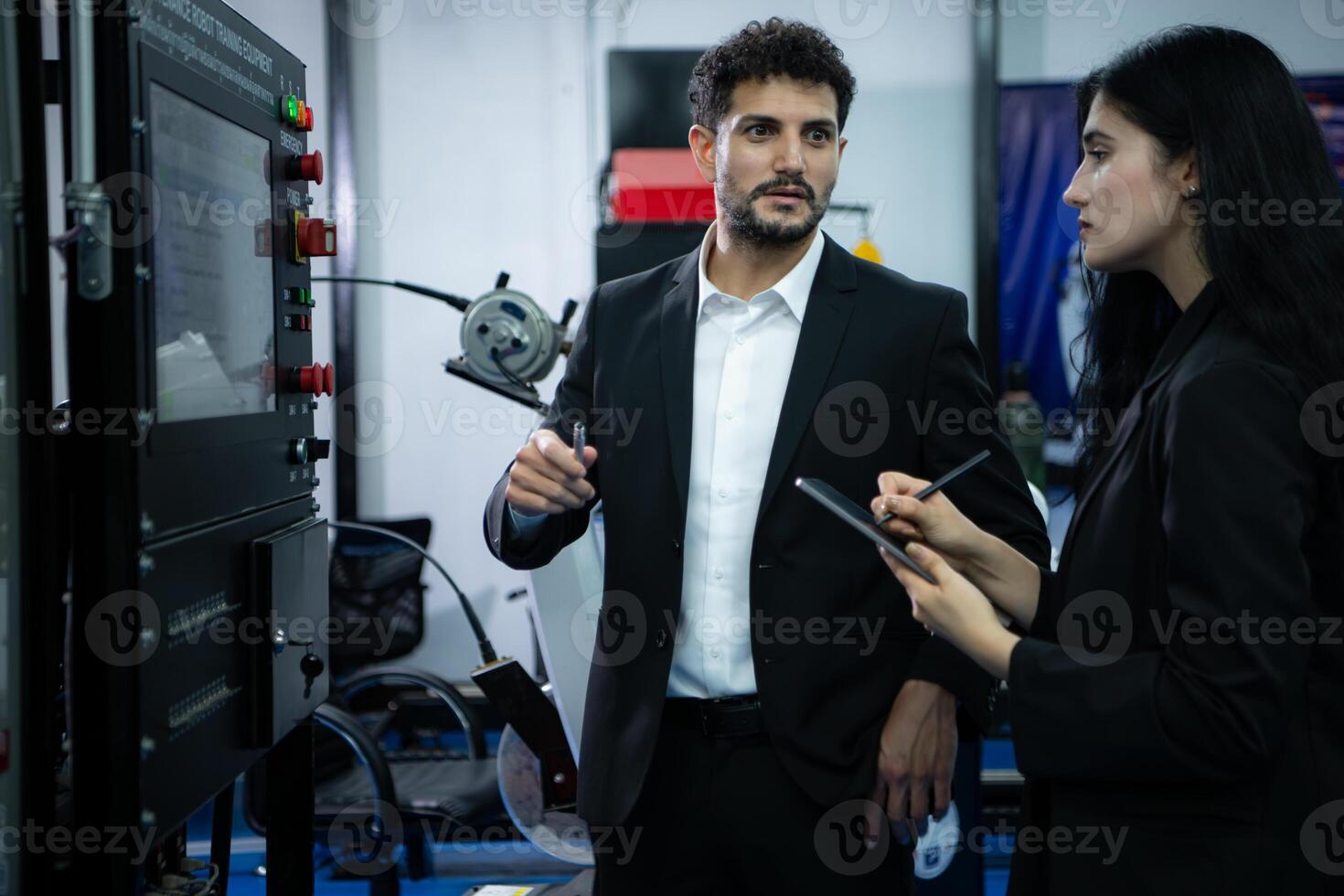 Businessperson of factory industry inspection and testing of robots arm for use in large-scale complex manufacturing industries. photo