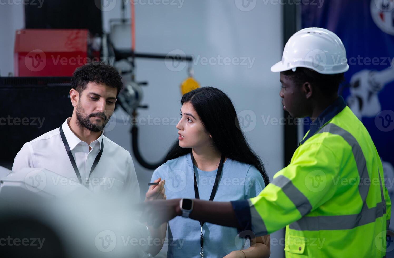 Technicians are introducing industrial hand robots to businessperson of factory industry who will use them in large-scale complex manufacturing operations. photo