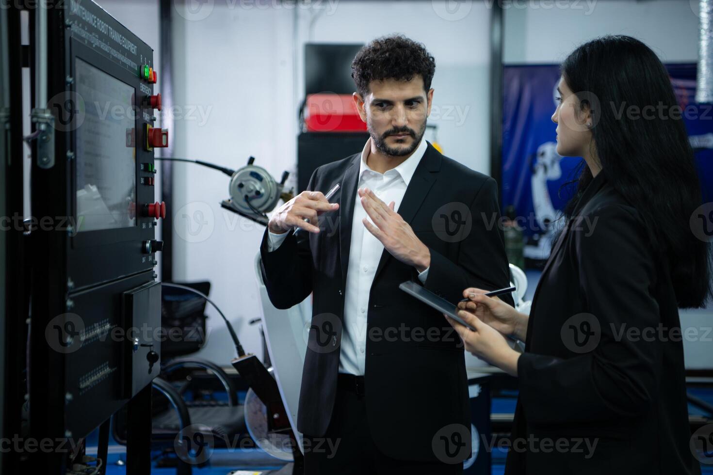 Businessperson of factory industry inspection and testing of robots arm for use in large-scale complex manufacturing industries. photo