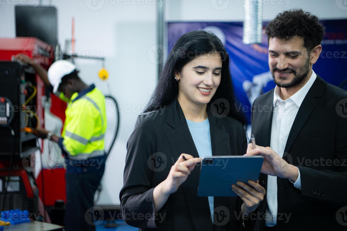Portrait of businessperson of factory industry inspection and testing of robots arm for use in large-scale complex manufacturing industries. photo