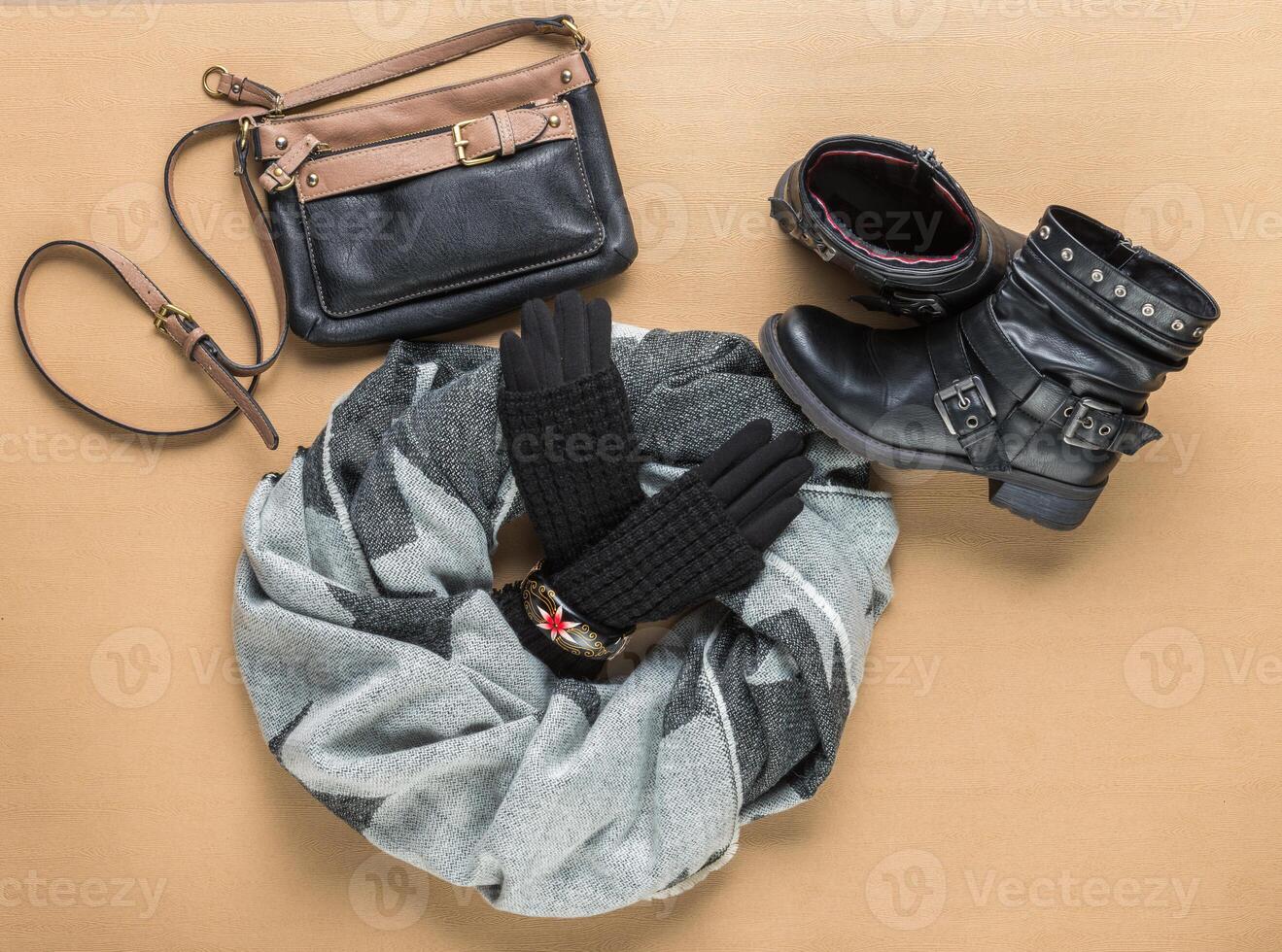 Knitted gloves, scarf and boots photo