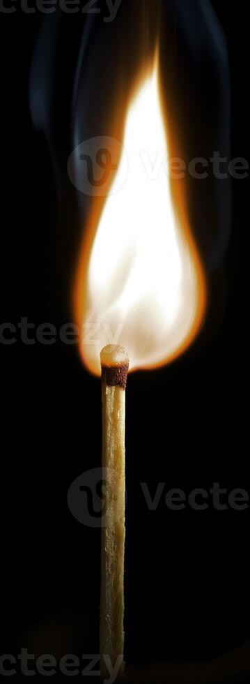 Wooden match burning on a black background photo
