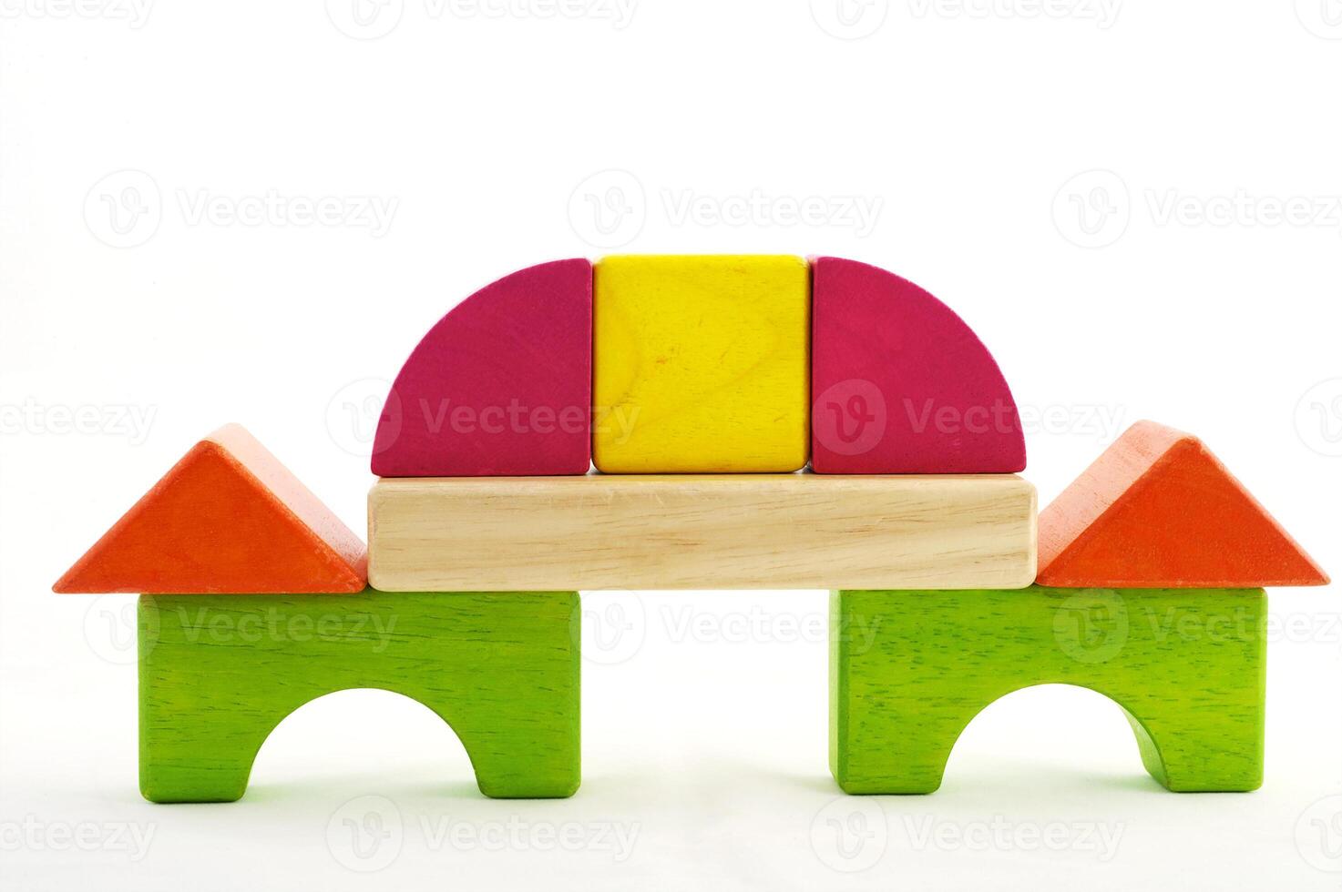 Wooden toy blocks on white background photo