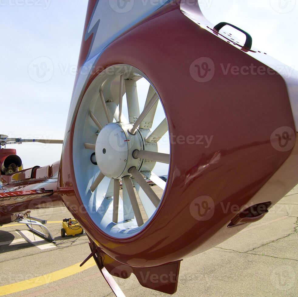Helicopter standing on the helipad at the airport photo