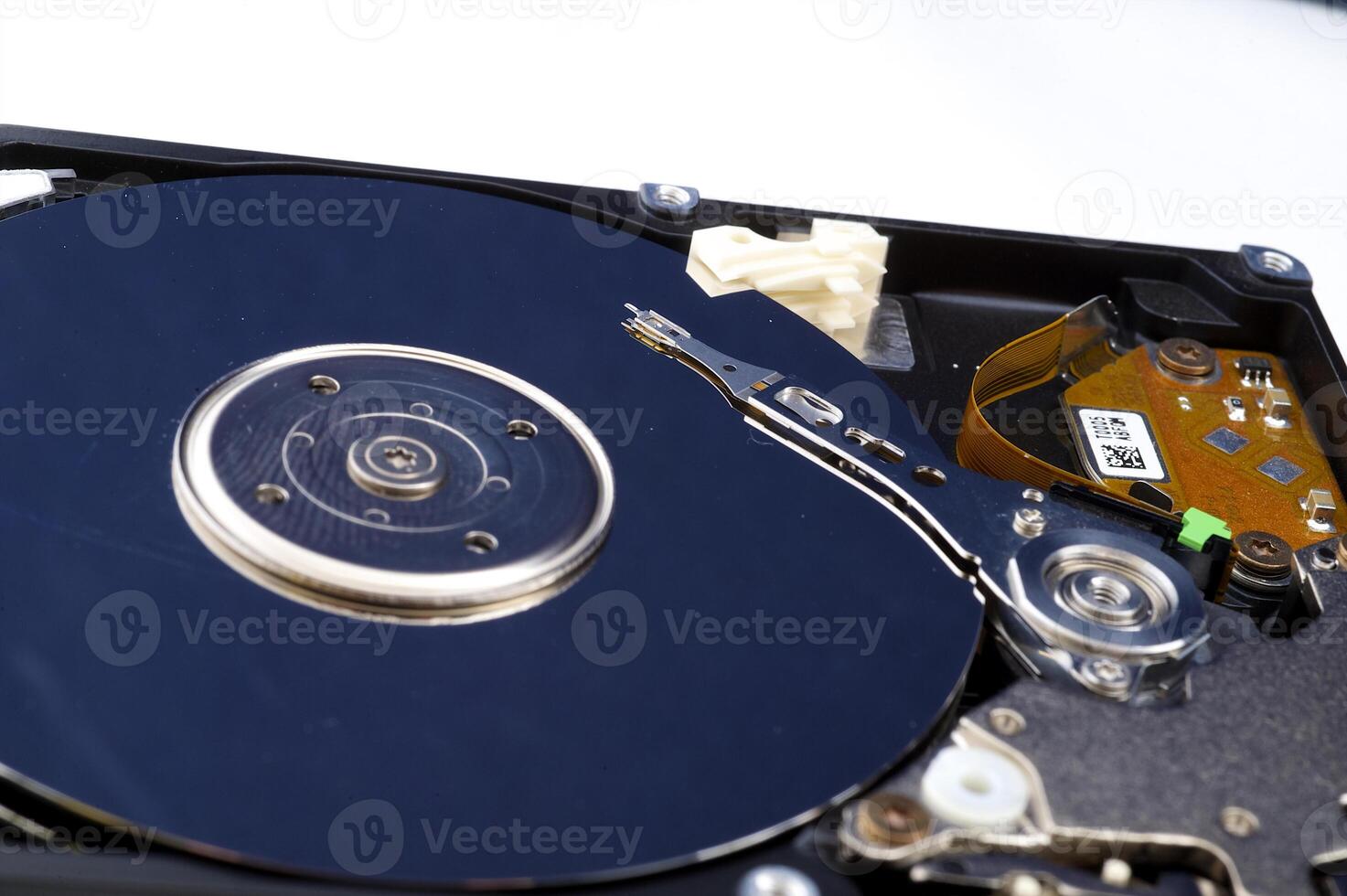 Close-up inside view of hard disk isolated on white background photo