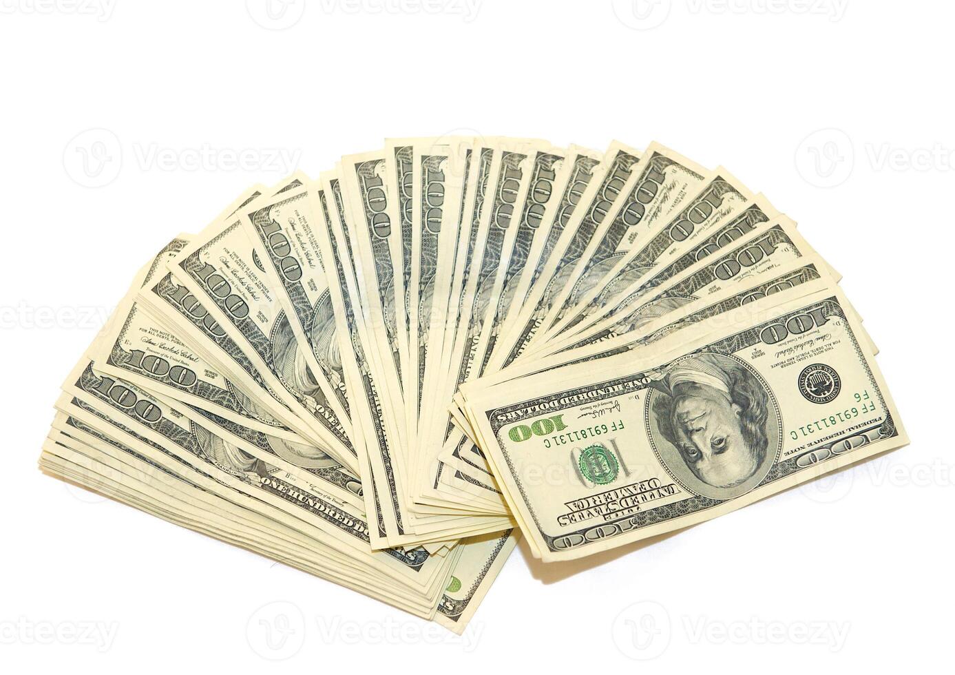 American dollars arranged in stacks of 100 bills each photo