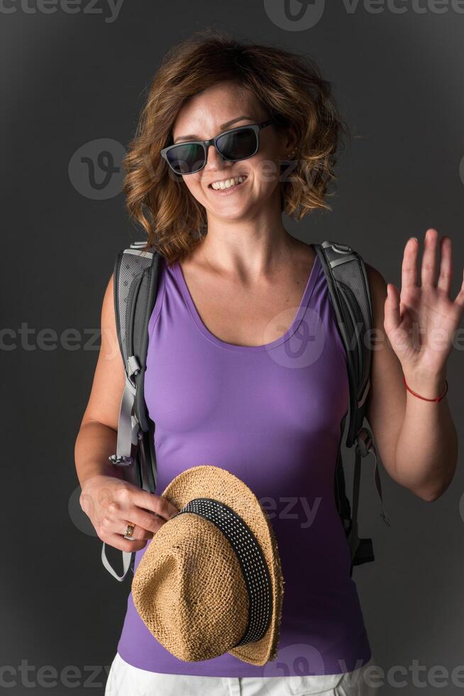 Young woman with hat and accessories in studio. photo