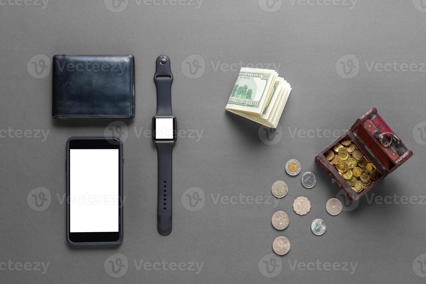 Business concept. Top view of dollars, watch, smartphone on color background photo