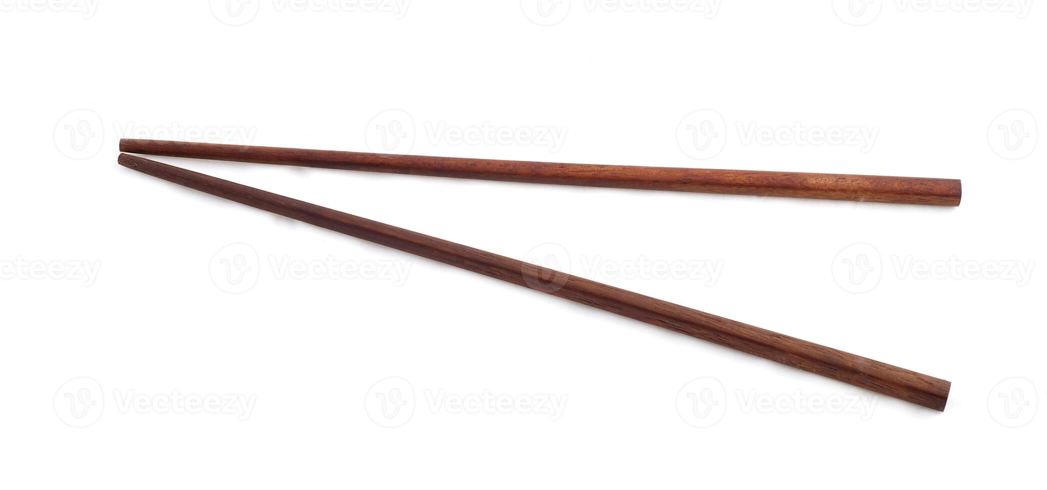 Wooden chopsticks on the white photo