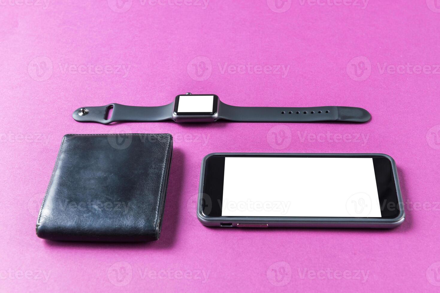 Business concept. Top view of dollars, watch, smartphone on color background photo