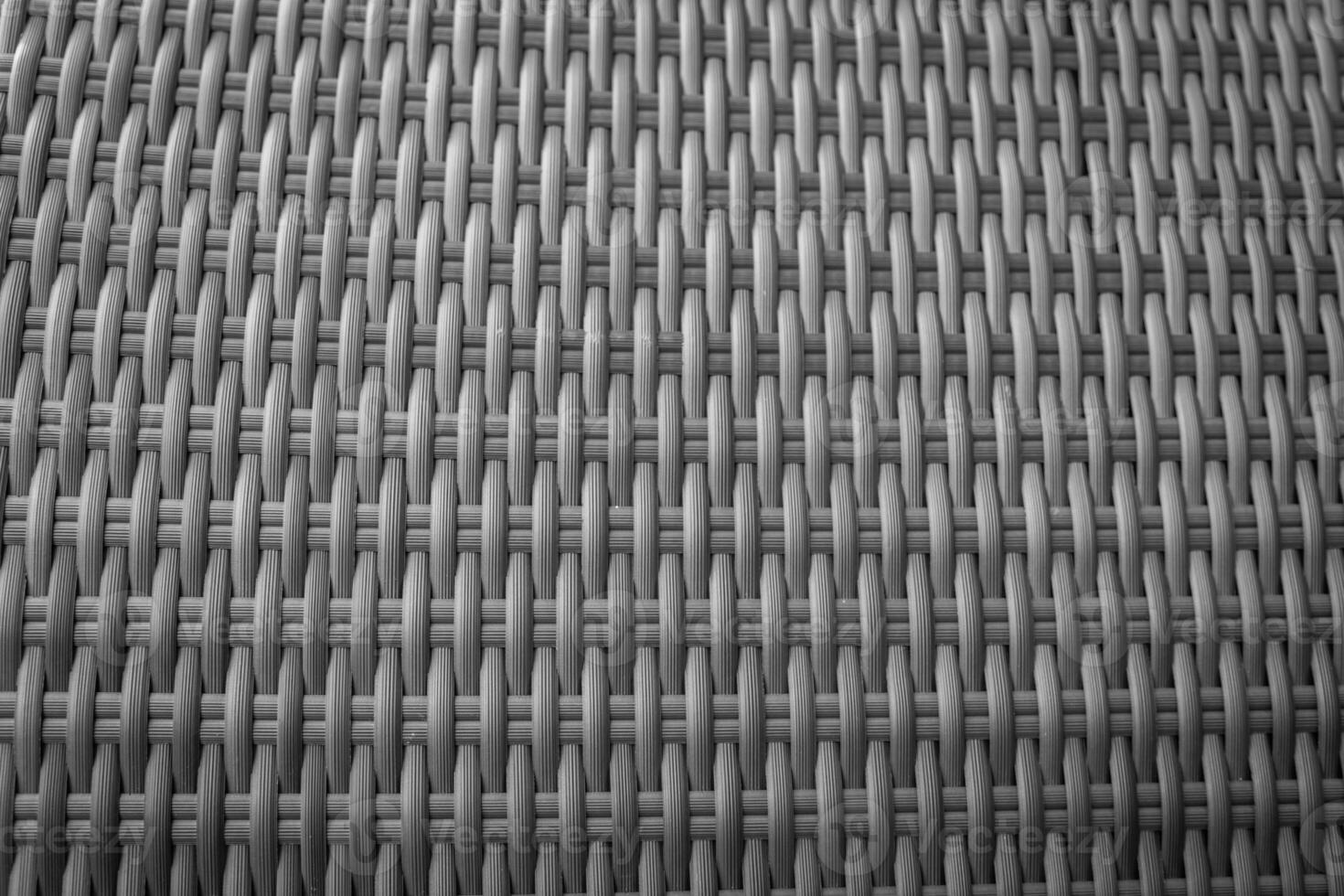 Synthetic rattan texture weaving background as used on outdoor garden furniture. photo