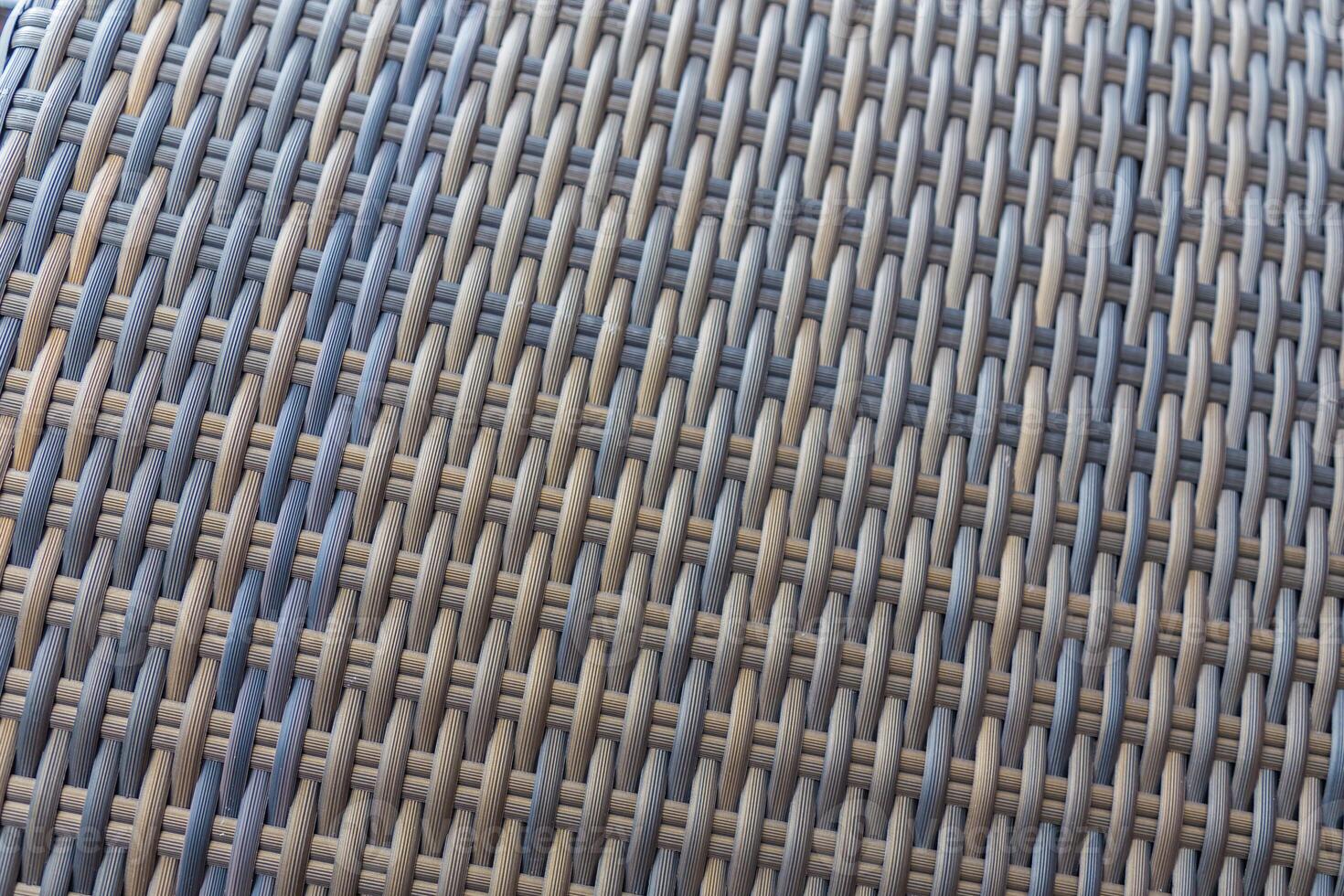 Synthetic rattan texture weaving background as used on outdoor garden furniture. photo