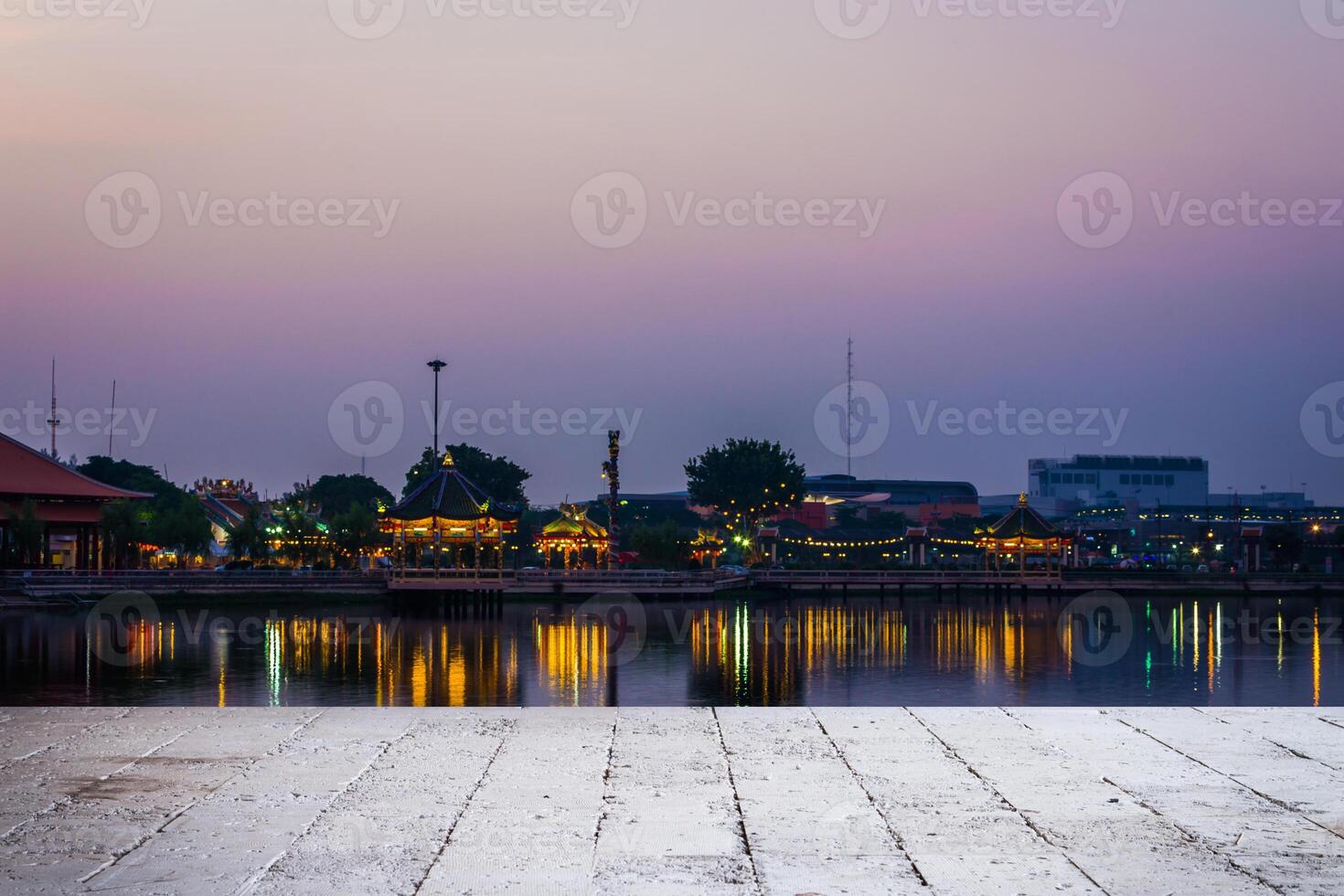 sunset of city on the park with reflections water photo