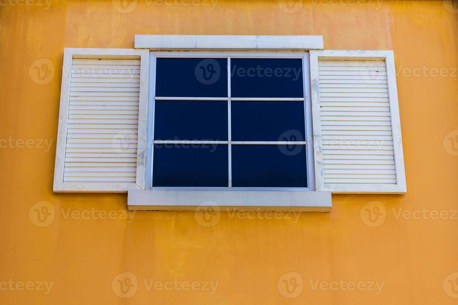 White windows and yellow color wall photo