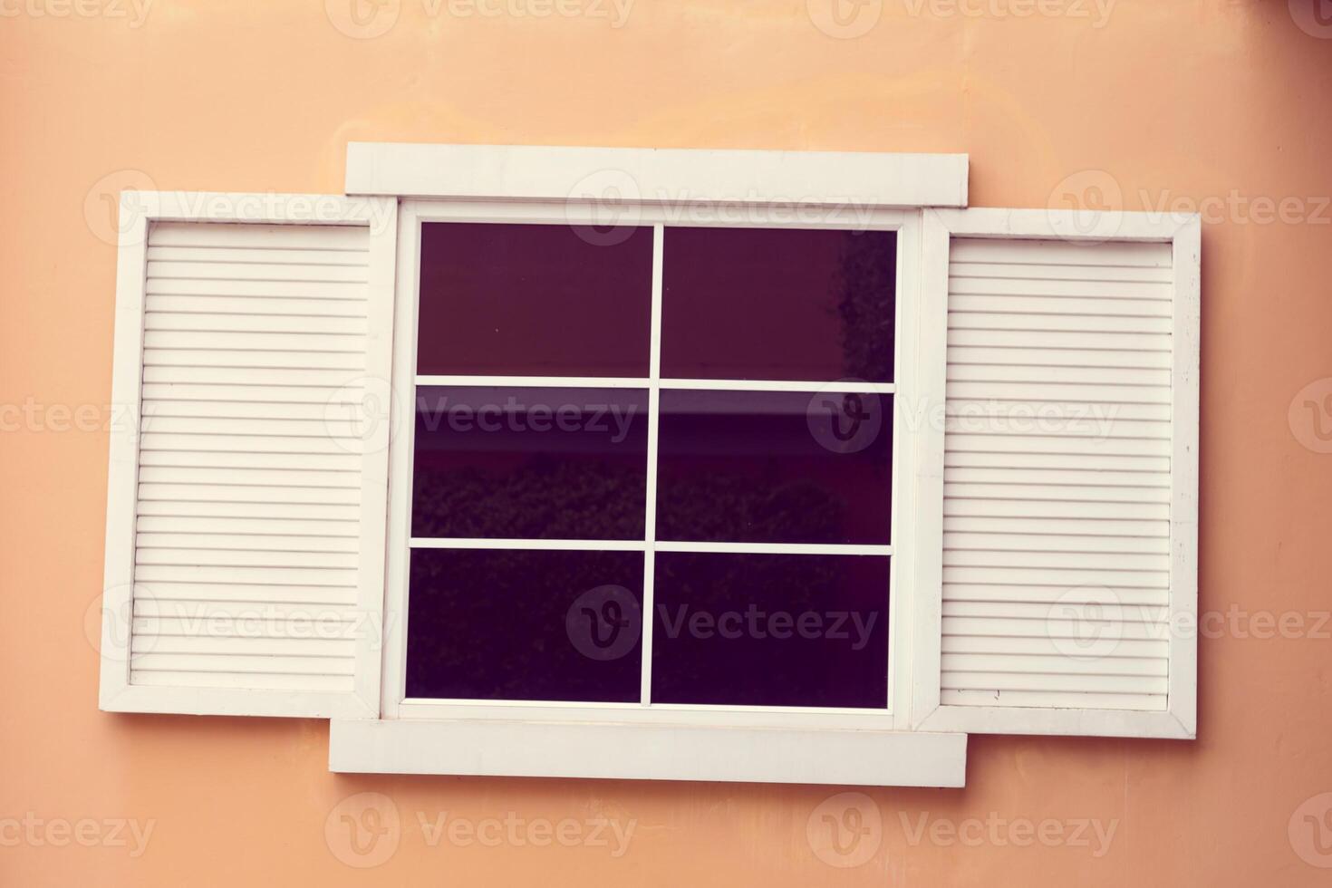 Vintage window on yellow cement photo