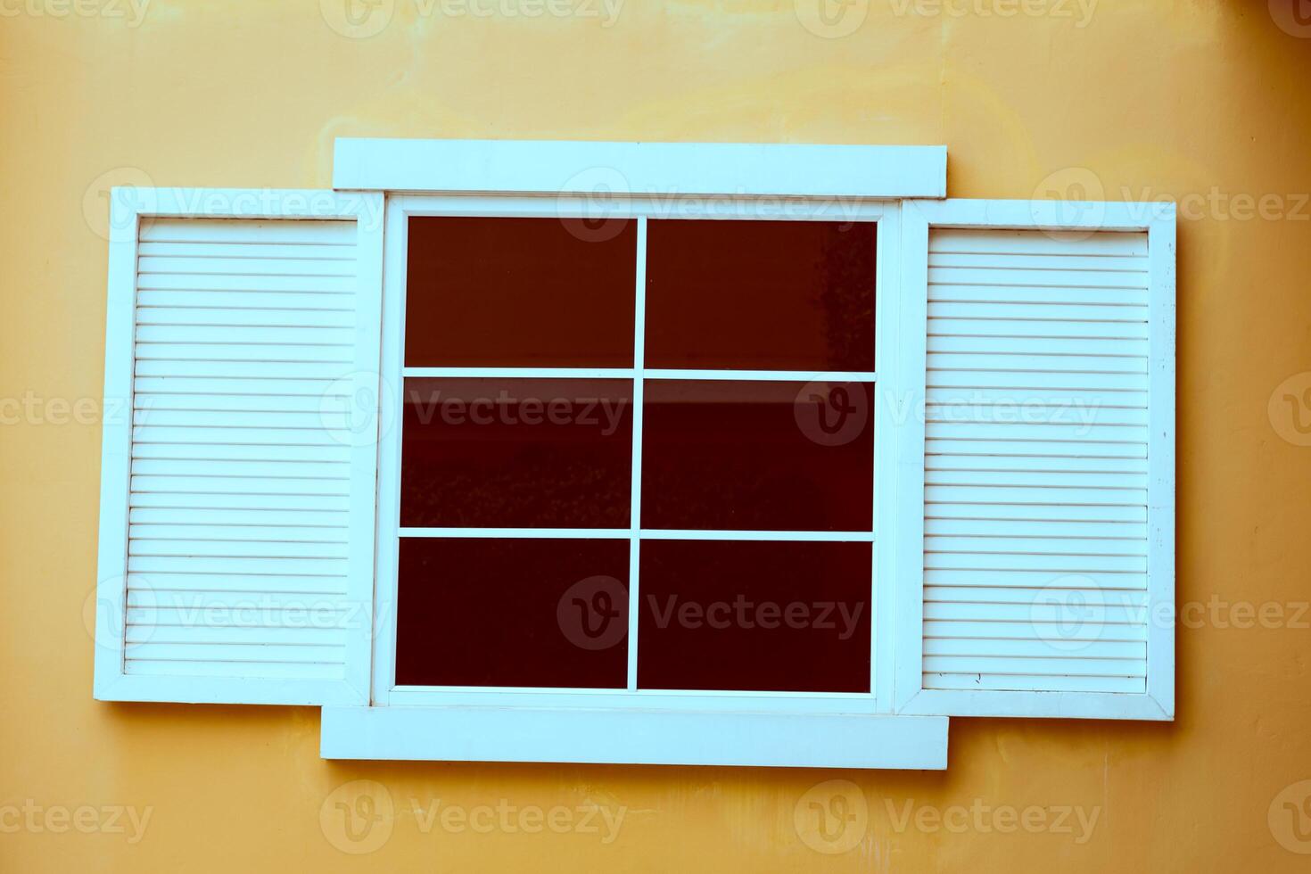 Vintage window on yellow cement photo