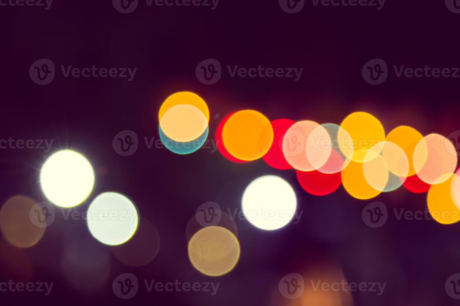 Color Bokeh against a dark photo