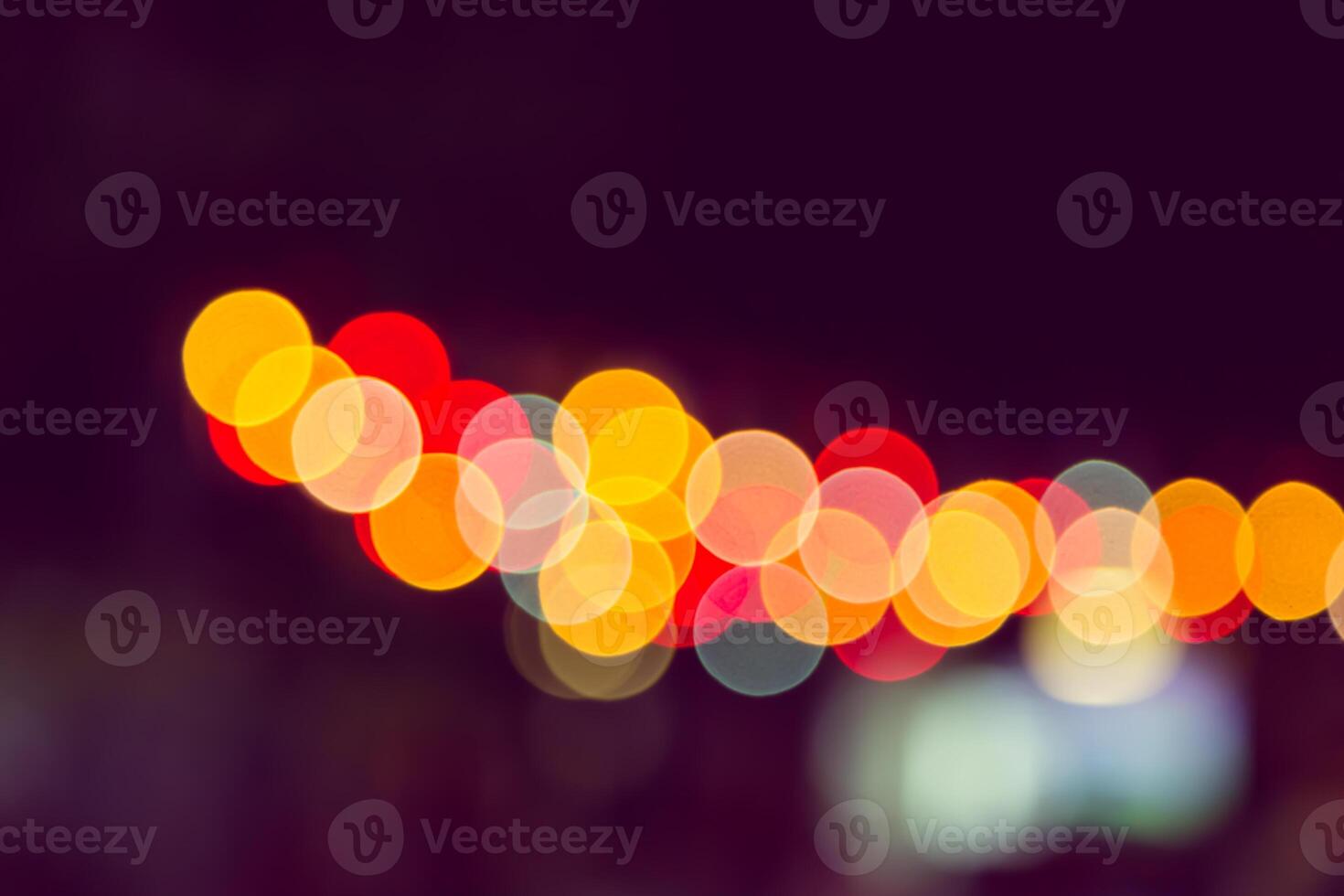 Color Bokeh against a dark photo