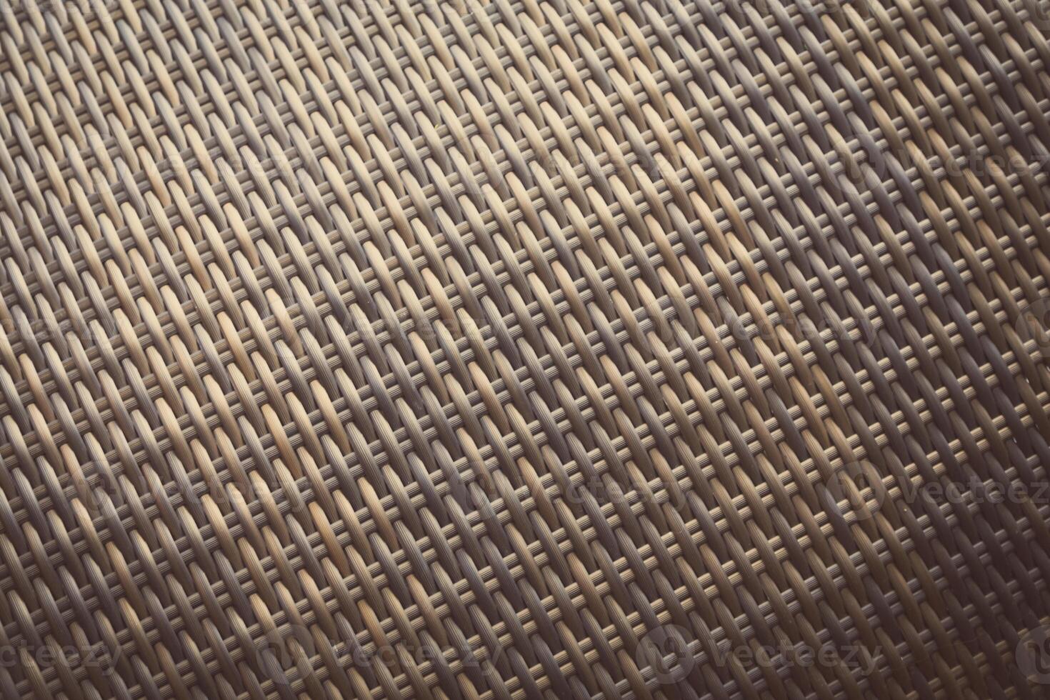 Synthetic rattan texture weaving background as used on outdoor garden furniture. photo
