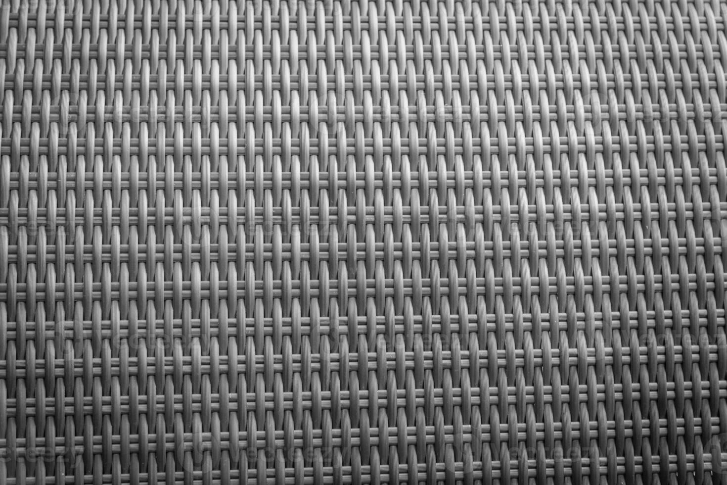 Synthetic rattan texture weaving background as used on outdoor garden furniture. photo