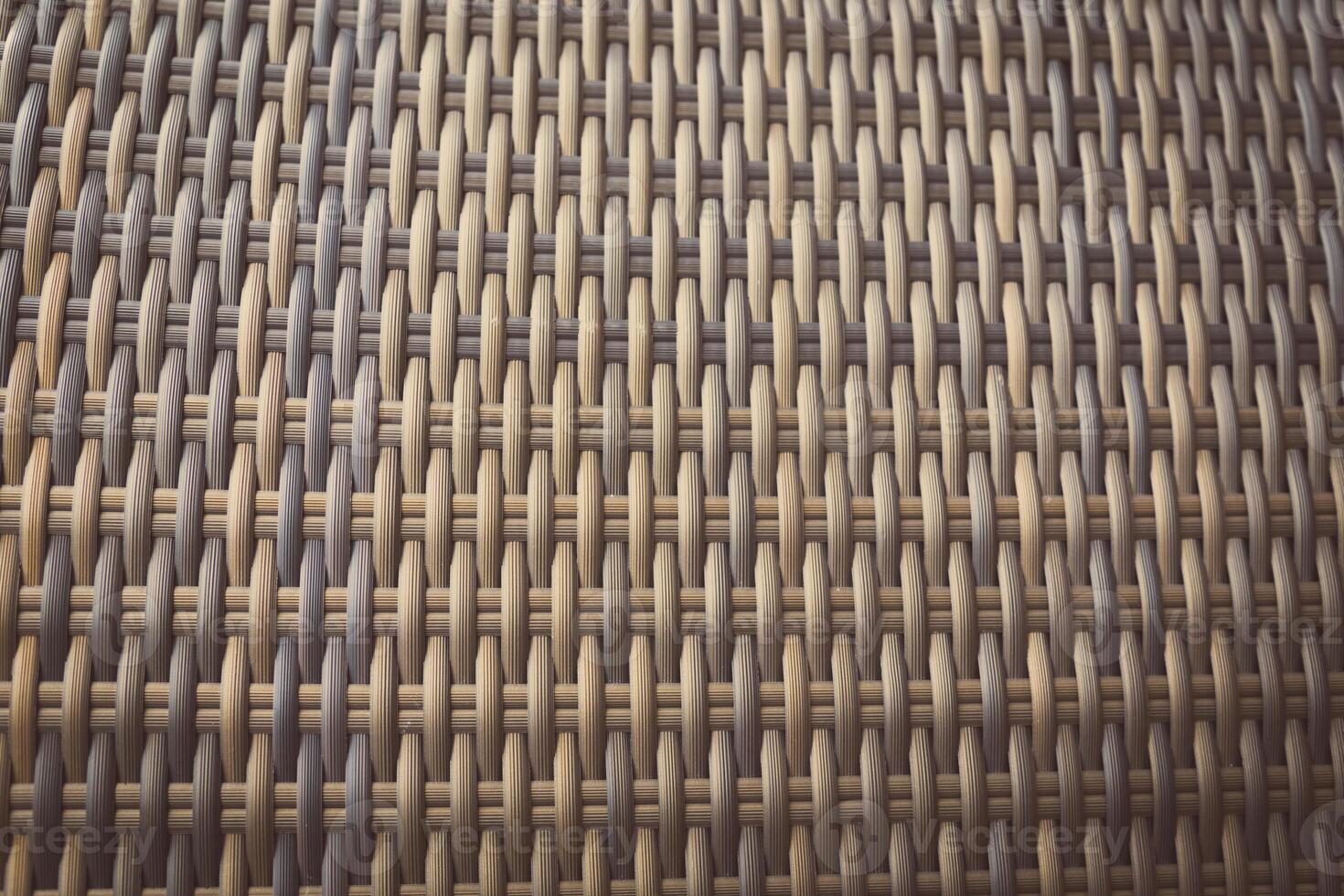 Synthetic rattan texture weaving background as used on outdoor photo