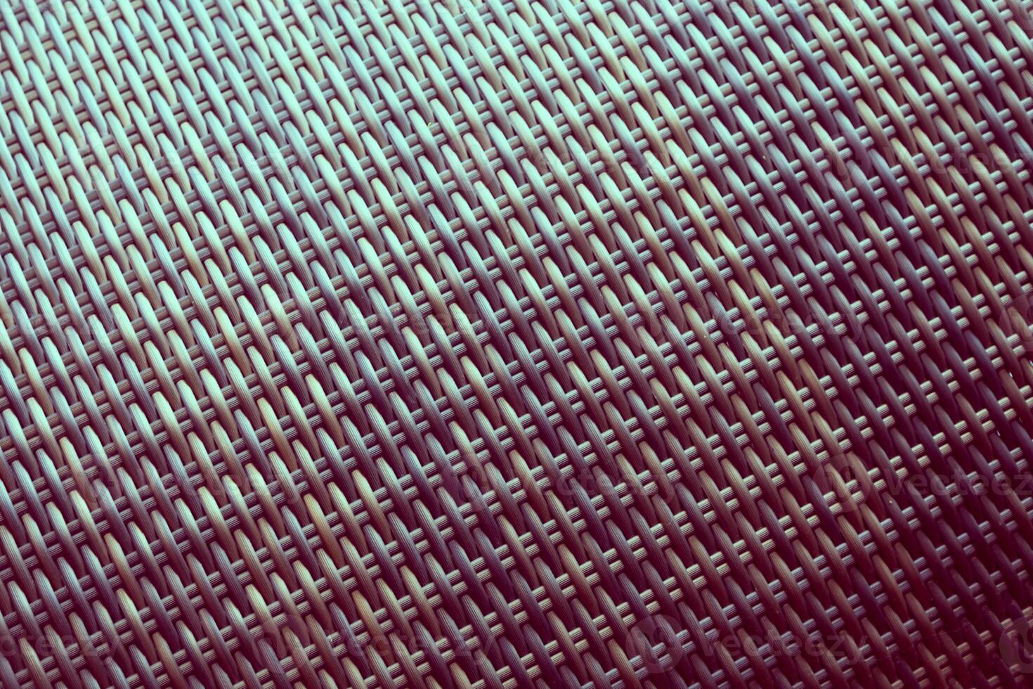 Synthetic rattan texture weaving background as used on outdoor garden furniture. photo